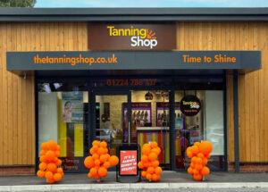 The Tanning Shop Scunthorpe store exterior with Time to Shine branding and orange balloons