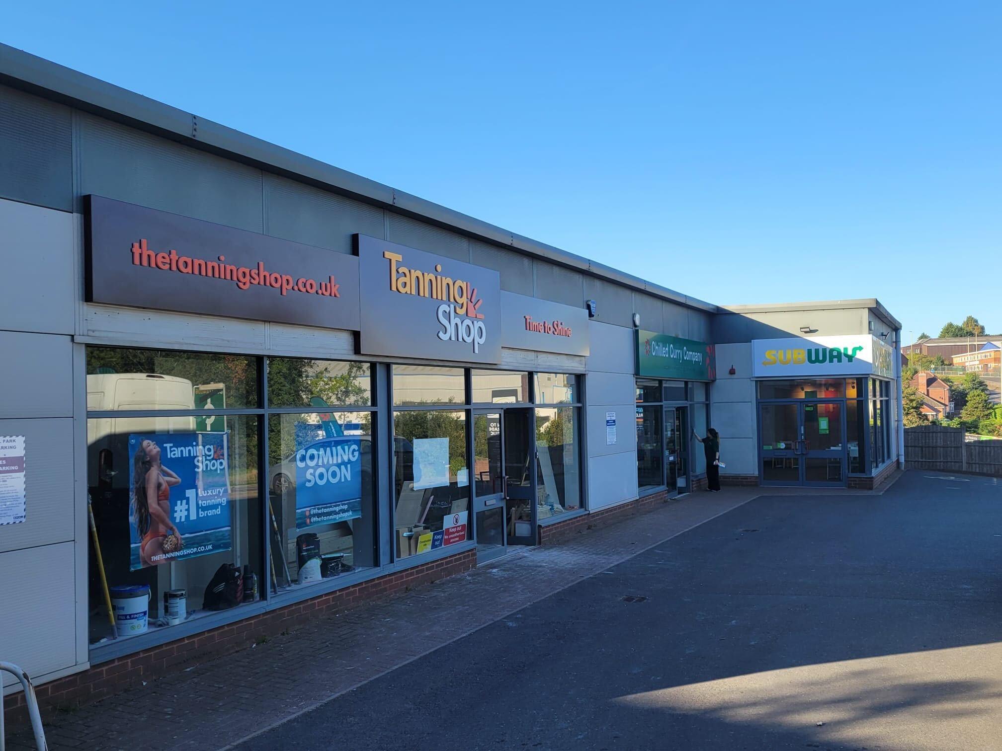 ef95e864-6cf1-4040-923d-89debd040edb The Tanning Shop UK new store coming soon exterior shopfront with staging.thetanningshop.co.uk signage