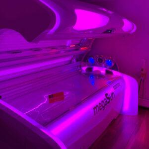 MegaSun tanning bed with purple LED lighting at The Tanning Shop Paddington