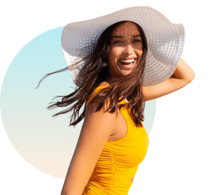 Woman Smiling in Sun Hat – Red Light Therapy for Mood and Wellbeing at The Tanning Shop UK