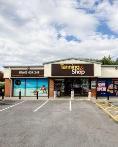 The Tanning Shop storefront with bold yellow signage and phone number 01642 434 349, used for the Corporate Discount page