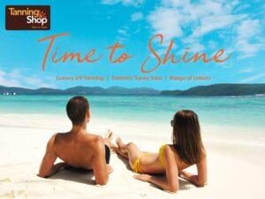 The Tanning Shop Time to Shine promotional image showing couple on beach with luxury UV tanning spray tan and lotions