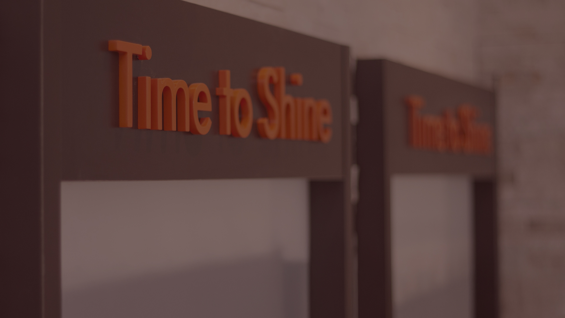 The Tanning Shop Time To Shine Tanning Room Doors Close-up of Time to Shine branded tanning room doors inside a Tanning Shop UK salon